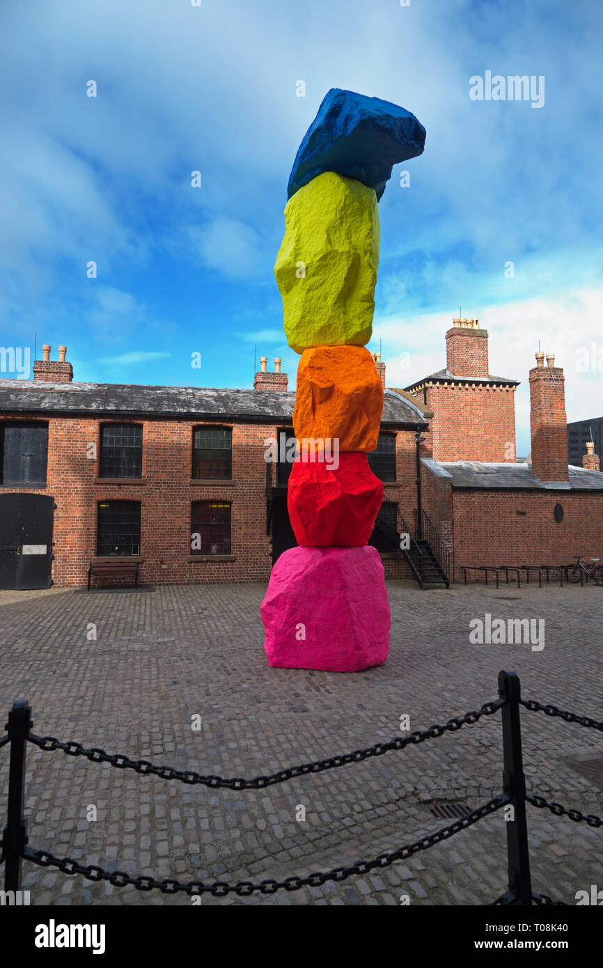 'Liverpool Mountain' by Swiss artist Ugo Rondinone’s 10-metre high sculpture stands in Mermaid Courtyard at Liverpool's Royal Albert Dock. Stock Photo