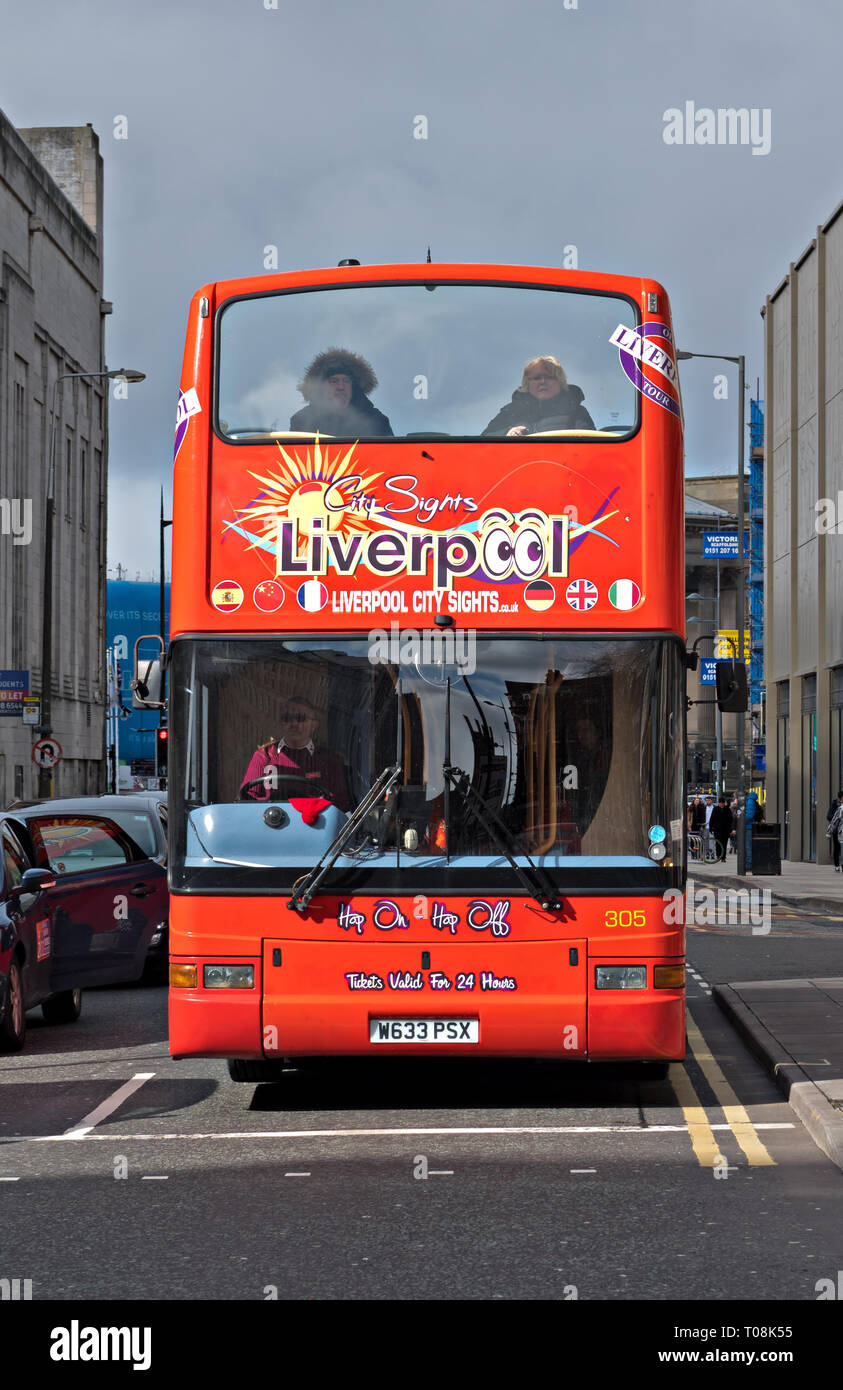 A Liverpool City Sights red open top tourist bus taking people on a tour of Liverpool UK Stock Photo