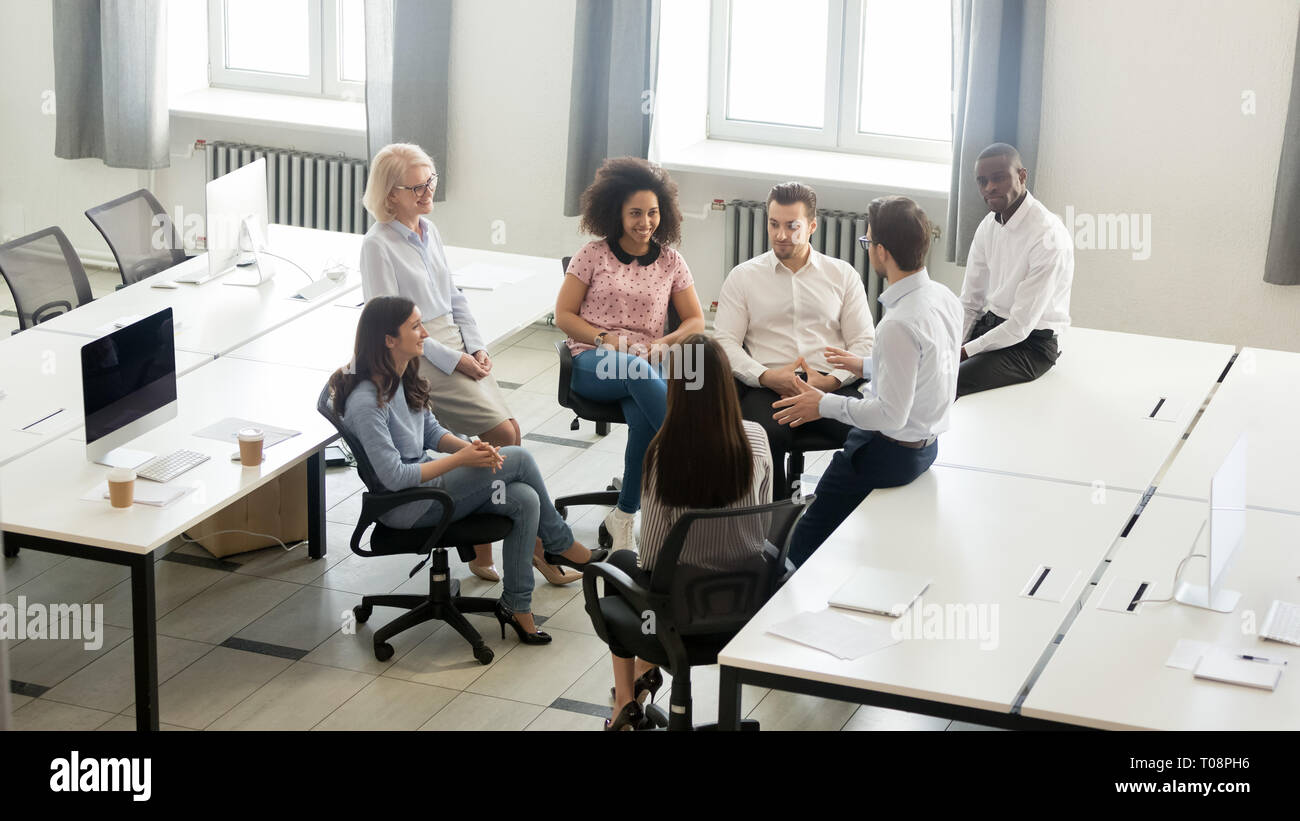 Male coach mentor speaking at corporate group meeting, top view Stock Photo