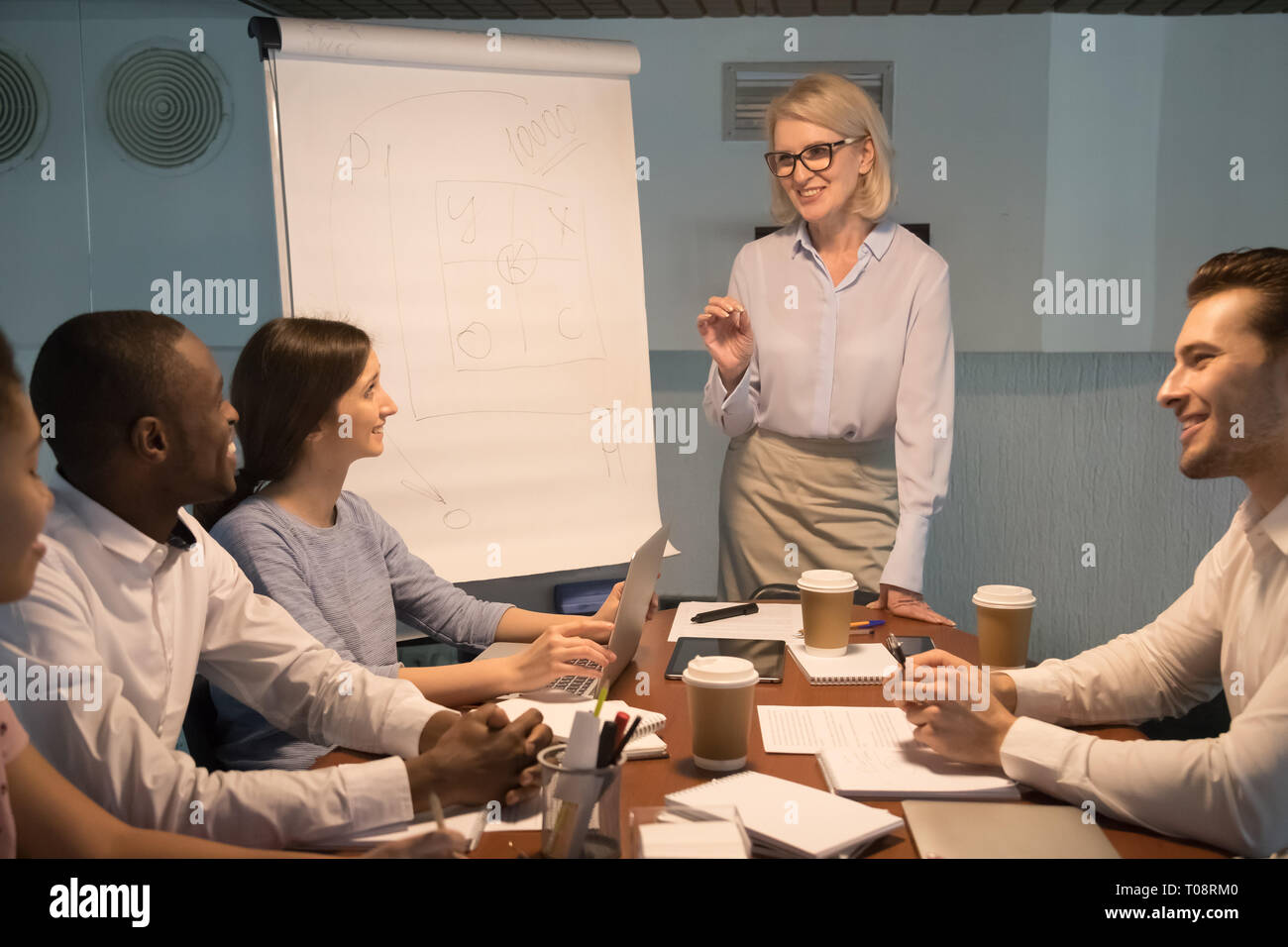 Young executive giving presentation on hi-res stock photography and ...