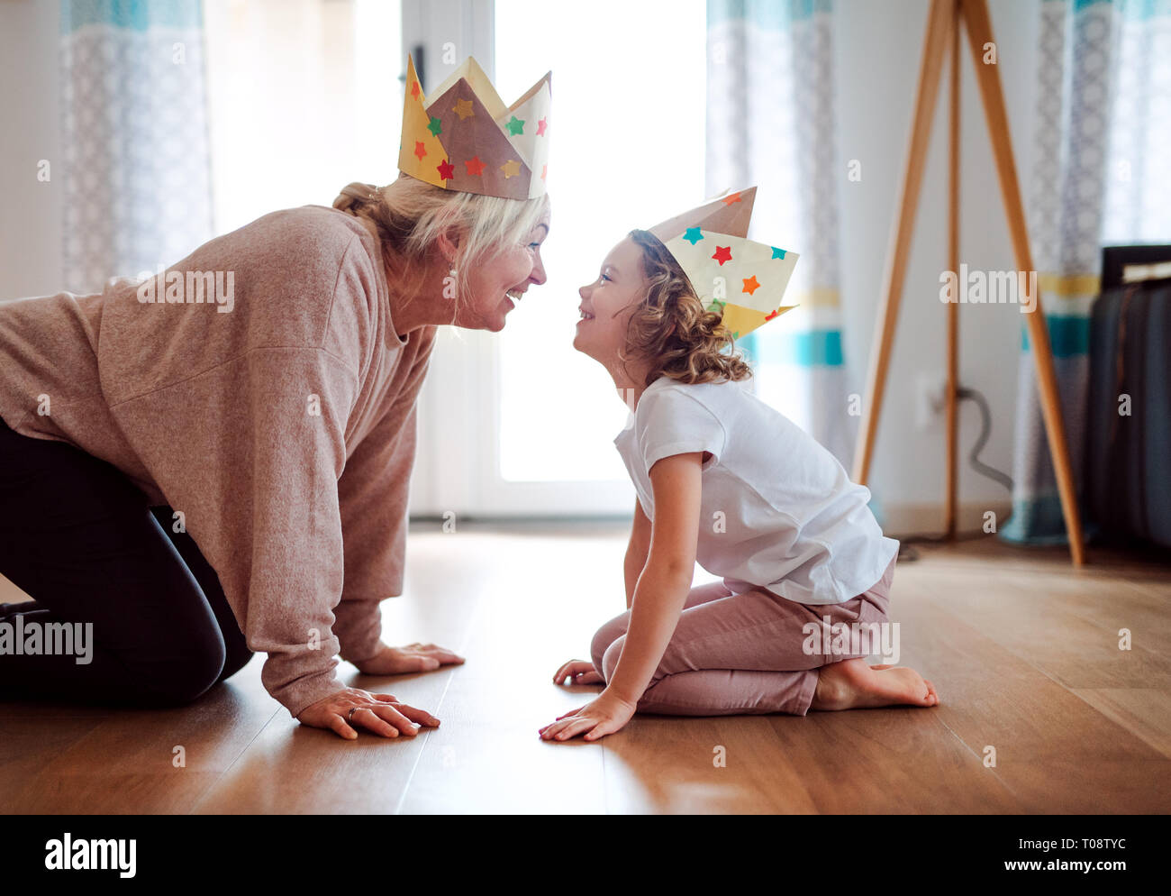 A portrait of small girl with grandmother having fun at home Stock ...