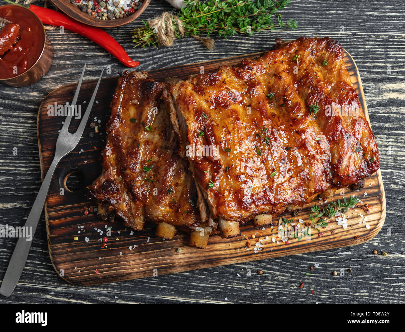 grilled pork ribs with sauce on a cutting board , spice, marinade Stock Photo
