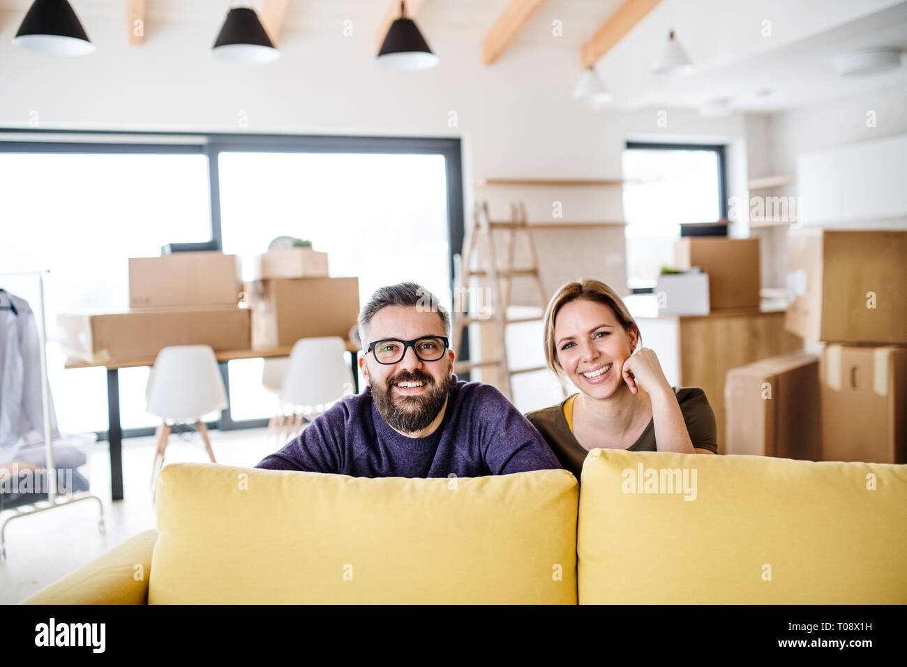 A portrait of young couple moving in new home Stock Photo - Alamy