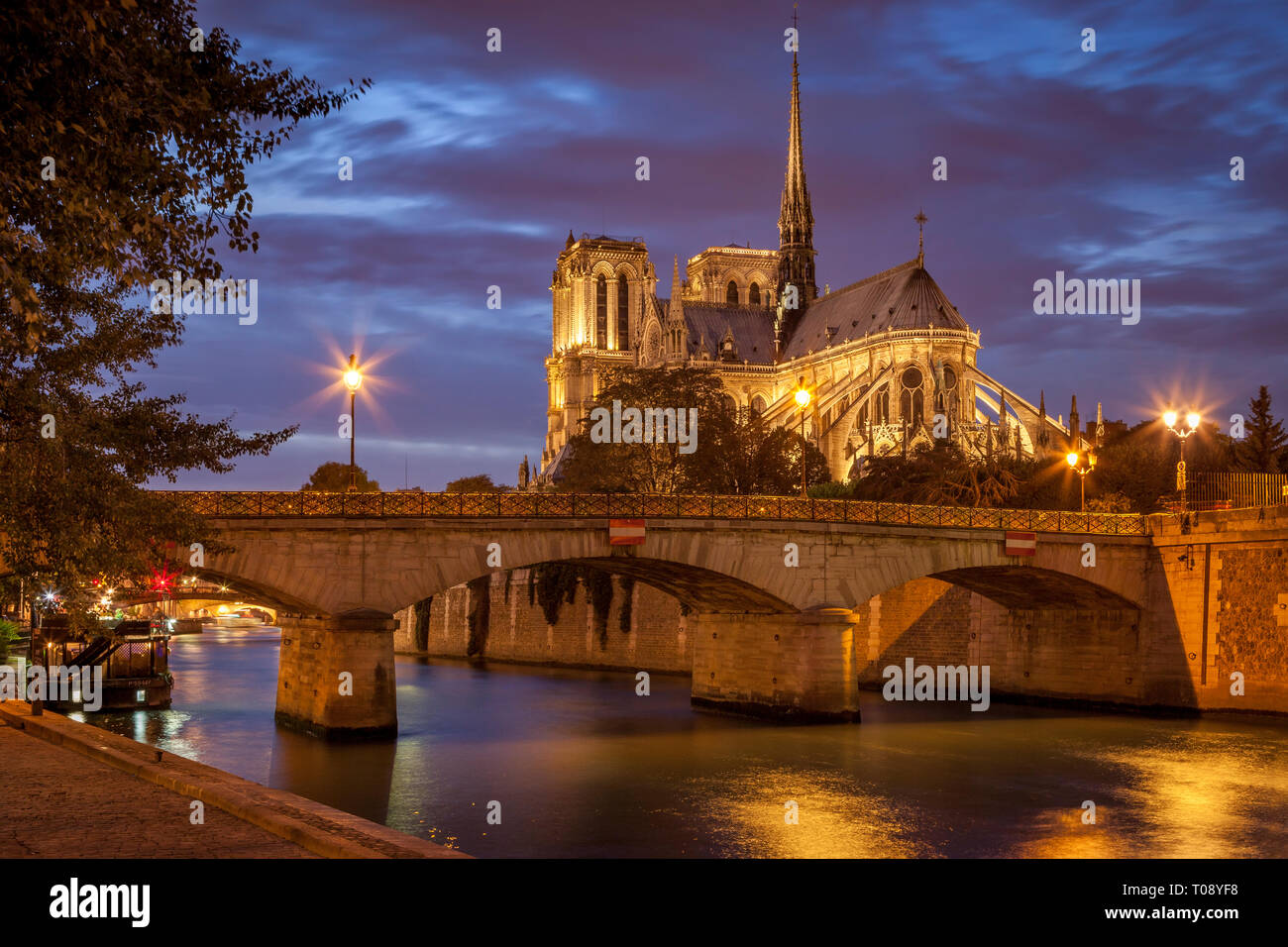 Twilight over Cathedral Notre Dame along River Seine, Paris, Ile-de-France, France Stock Photo