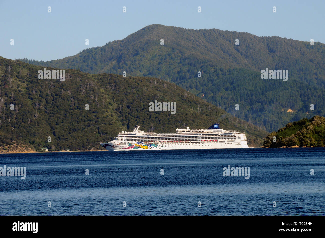 The Norwegian Jewel, large cruise ship for 2376  passengers makes its way out of the port of Picton and into the main channel of Queen Charlotte Sound Stock Photo