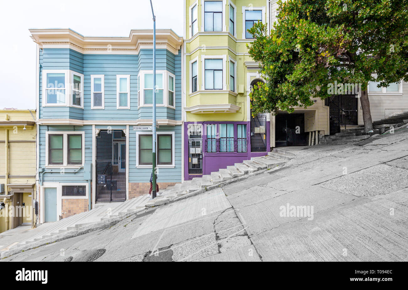 Classic urban scene of historic colorful buildings along one of San Francisco's steepest streets near Telegraph Hill residential area district Stock Photo