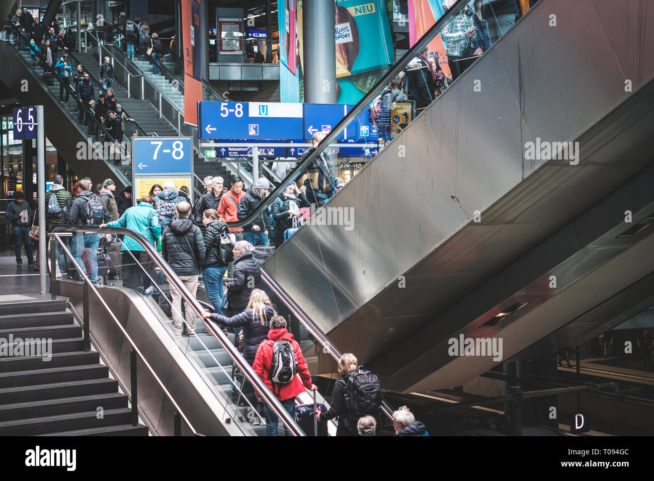 Berlin, Germany - march 2019: Traveling people on crowded   escalator inside  train station (Hauptbahnhof) in Berlin, Germany Stock Photo