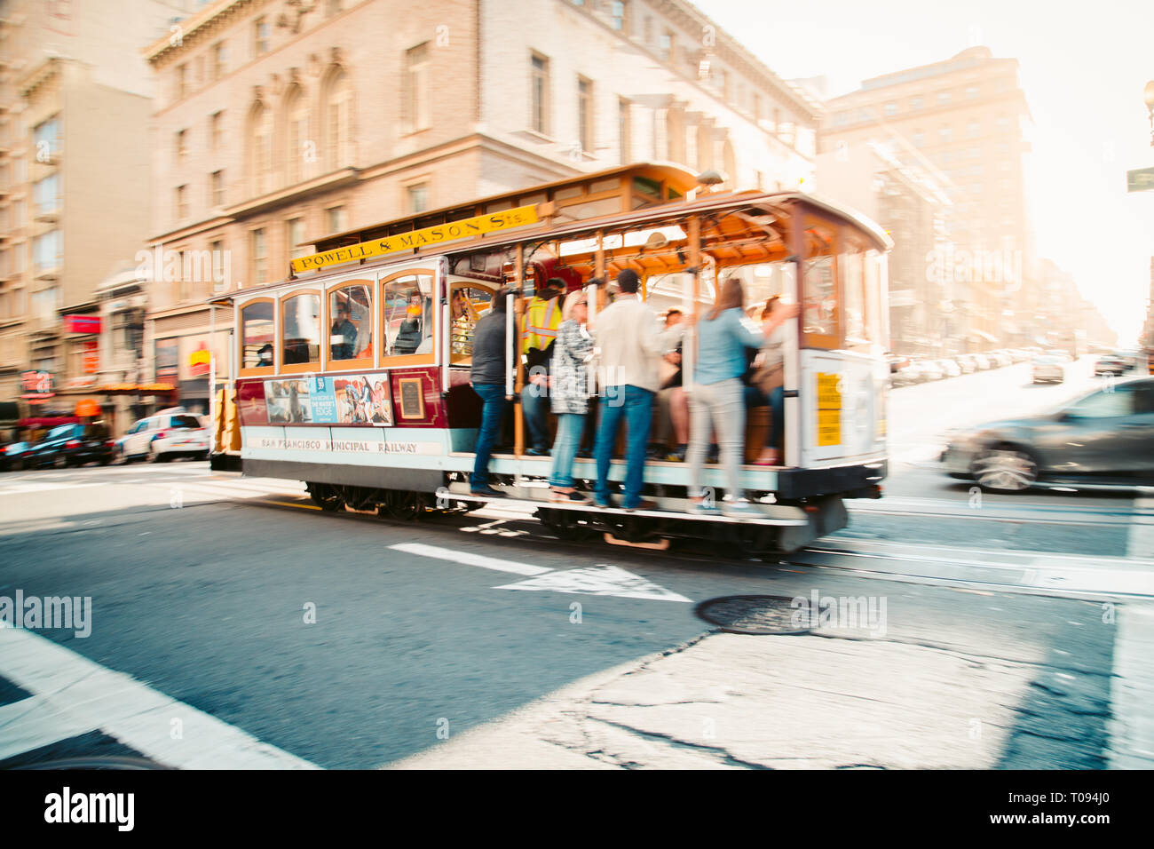 SEPTEMBER 5, 2016 - SAN FRANCISCO: Traditional Powell-Hyde cable car riding in central San Francisco in beautiful golden evening light at sunset, Cali Stock Photo