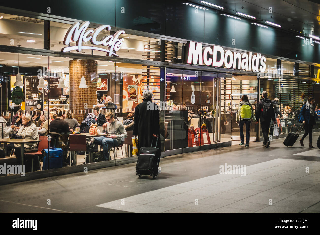 Berlin, Germany - march 2019: McDonalds and McCafe fastfood restaurant inside train stration (Berlin Hauptbahnhof). Stock Photo