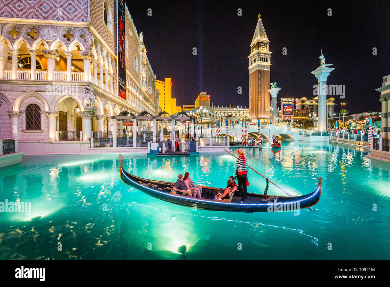 Downtown Las Vegas with world famous Strip and The Venetian and The Mirage Resort Hotels illuminated at night, Nevada, USA Stock Photo