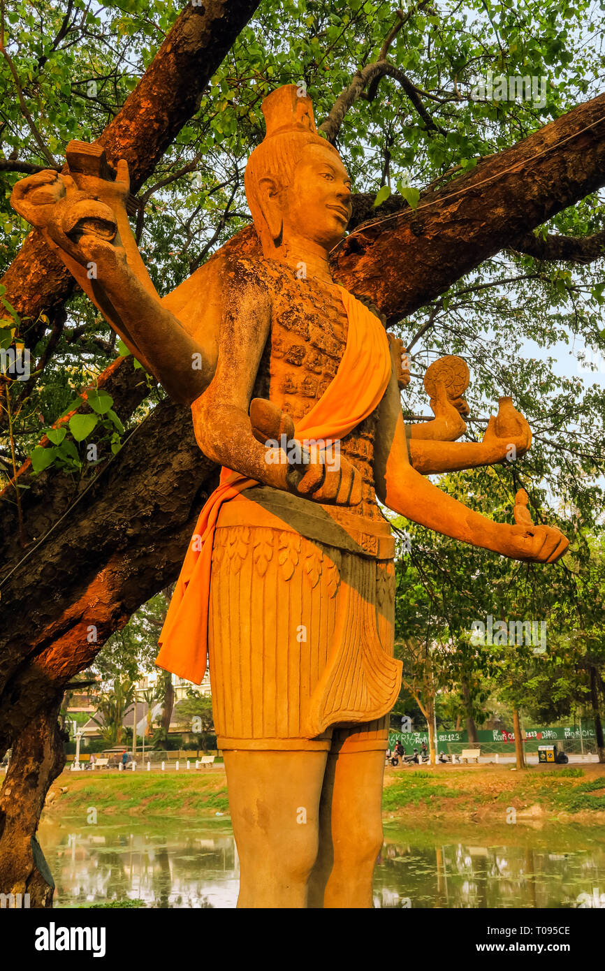 Eight armed statue of Hindu god Vishnu by the Siem Reap River in the center of this north west tourist town; Siem Reap, Cambodia Stock Photo