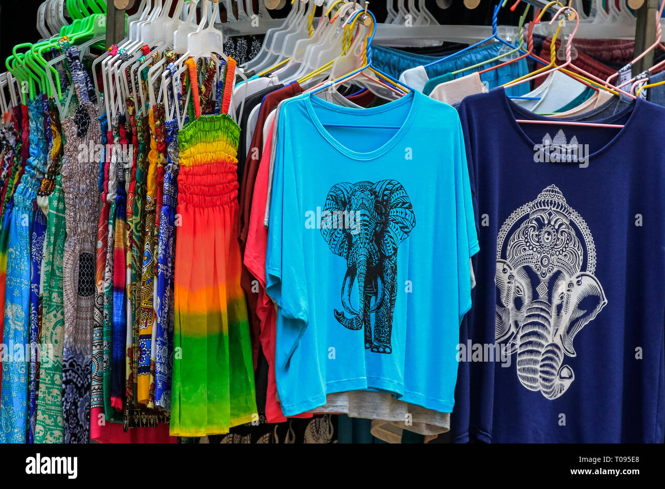 Tourist souvenir T shirts & dresses on sale in the Angkor Thom walled city complex; Angkor, Siem