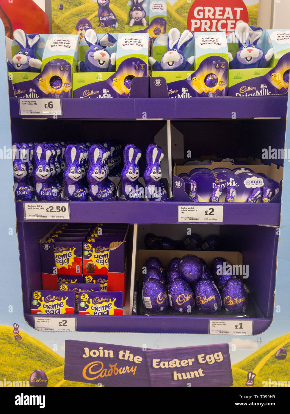 Exeter, Devon , England, March, 14, 2019: A supermarket in the UK end cap, selling chocolate Easter Eggs, chocolate Easter Bunnies. Lots of purple in  Stock Photo