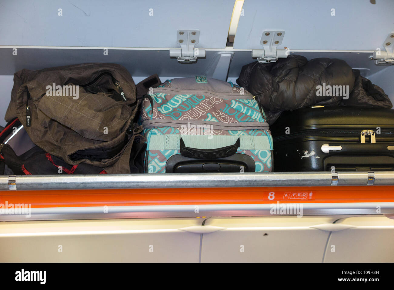 Overhead passenger locker / lockers / compartment / compartments for stowing passengers bags cabin luggage on an Easyjet Airbus A320 or  A319 plane. Stock Photo