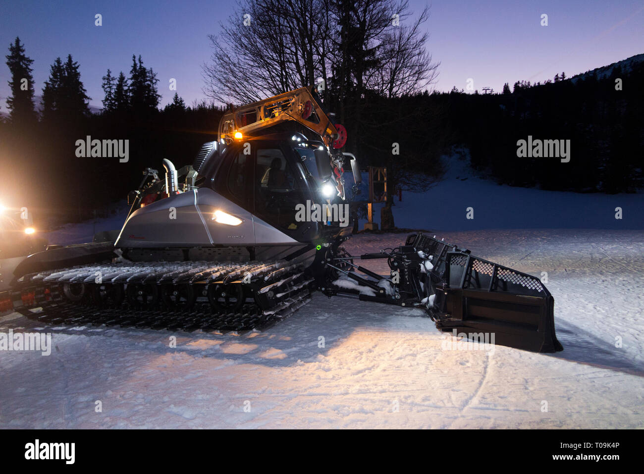 Snow Groomer made by Prinoth Leitwolf crawler ready to prepare the piste / ski slopes at resort Aillons-Margériaz 1600, in France. (104) Stock Photo