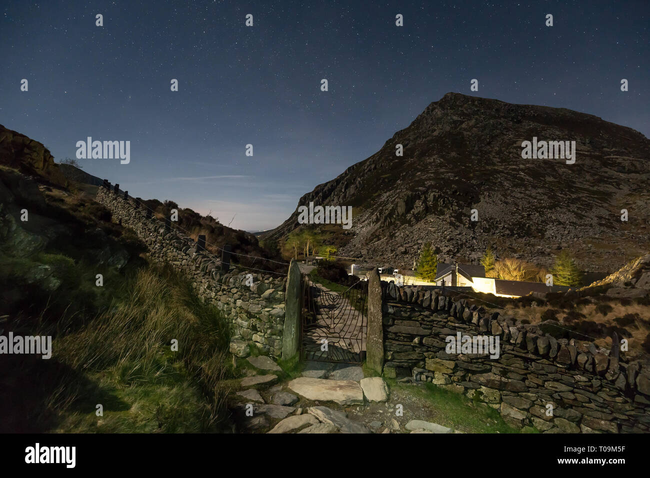 Scenic, starry, night time view in Snowdonia National Park, looking across to Pen yr Ole Wen after mountain walk at night returning from Llyn Idwal. Stock Photo