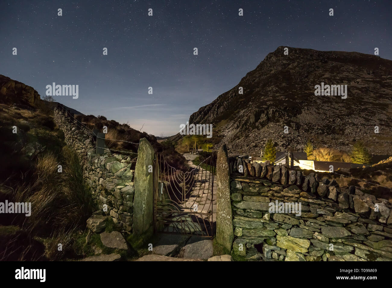 Scenic, starry, night time view in Snowdonia National Park, looking across to Pen yr Ole Wen after mountain walk at night returning from Llyn Idwal. Stock Photo