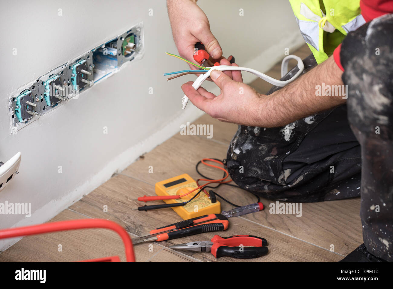 Electrician Hands Installing Wall Socket Stock Photo - Alamy