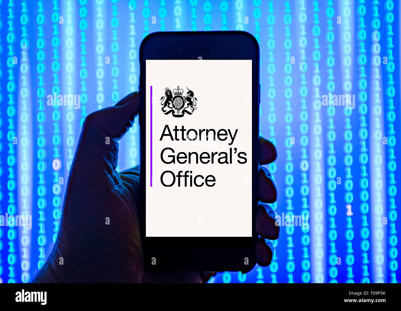 Person holding smart phone with  Attorney General's Office   logo displayed on the screen. Stock Photo
