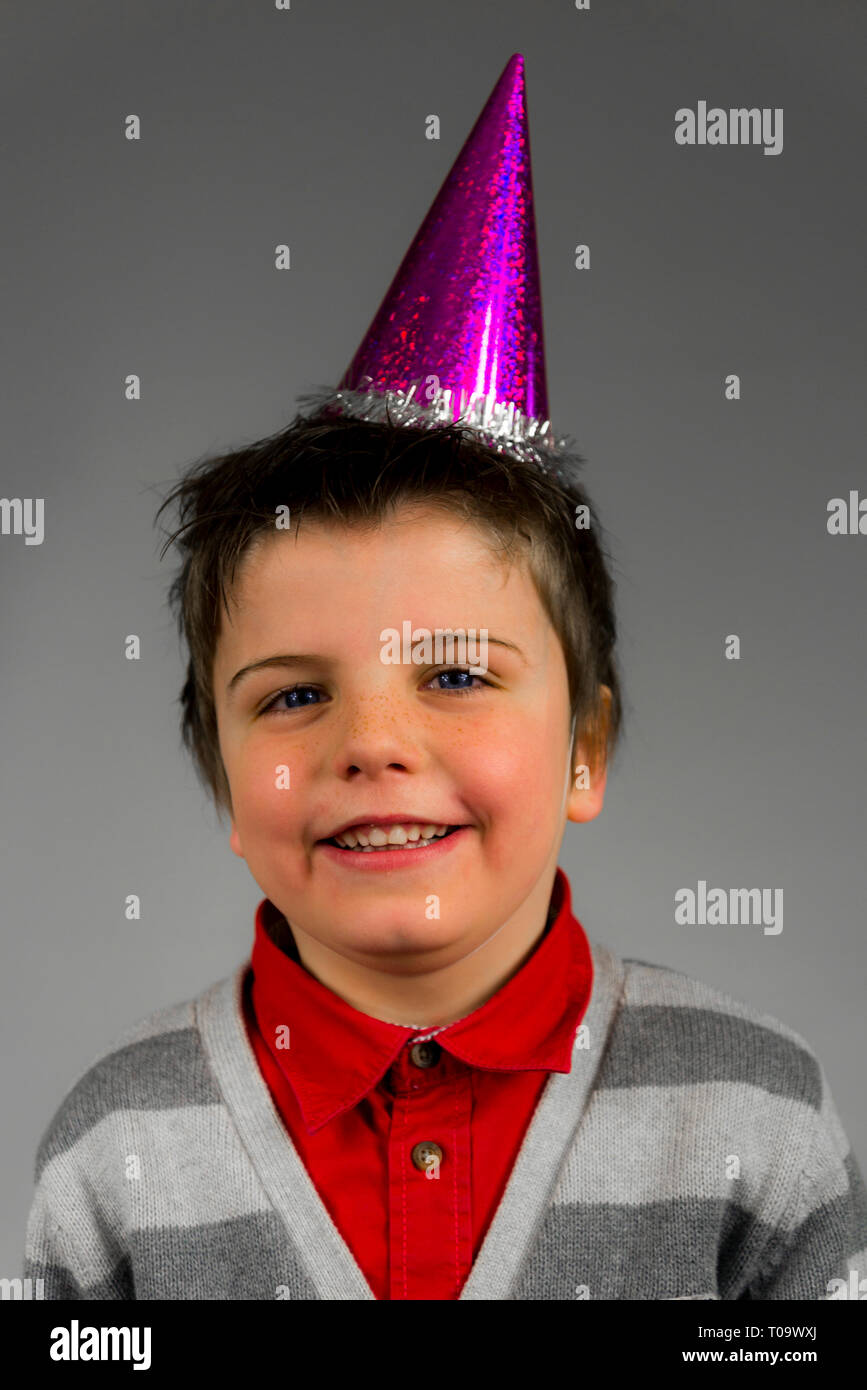happy little boy with party head on Stock Photo