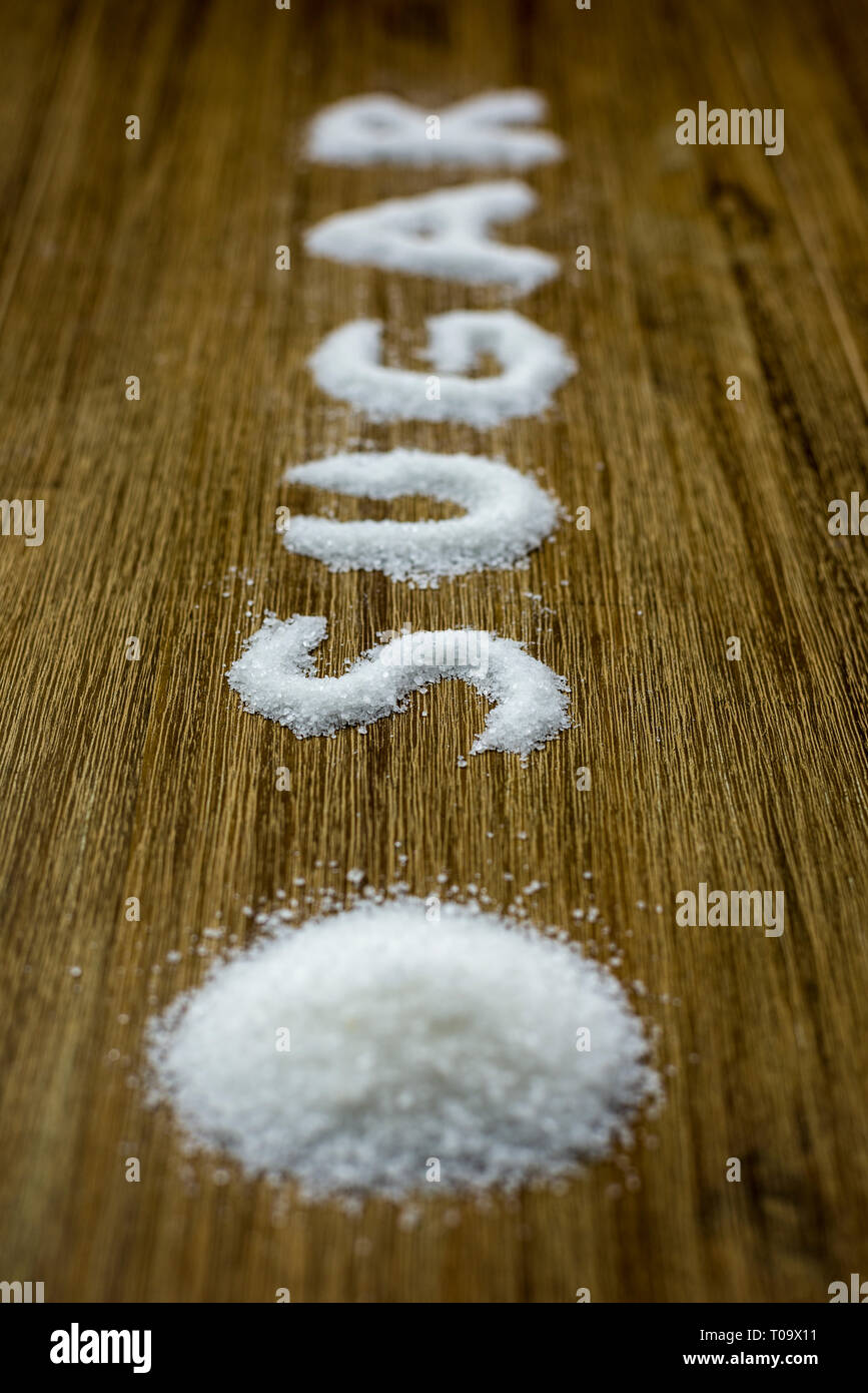 sugar text written with sugar crystals on table Stock Photo - Alamy