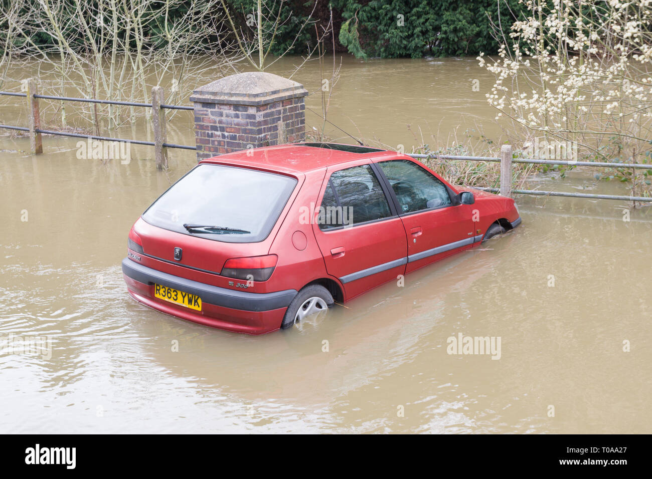 Bridgnorth, Shropshire, UK. 19th March, 2019. A car is stuck in the River Severn floodwater in Bridgnorth town. Peter Lopeman/Alamy Live News Stock Photo