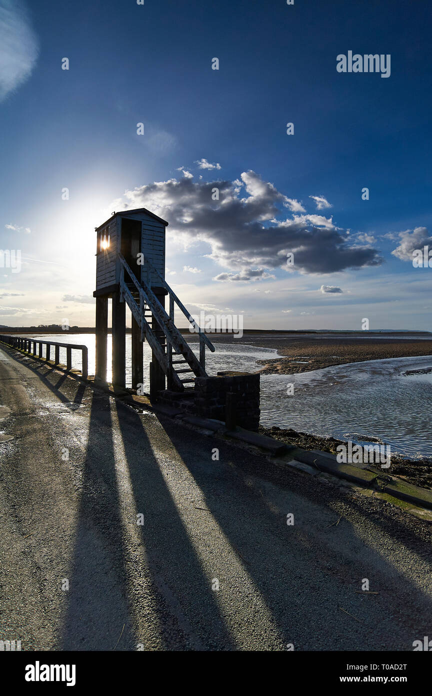 The Tidal causeway crossing to the Island of LIndisfarne (Holy Island) on the Northumbrian coast of England, UK, GB. Stock Photo