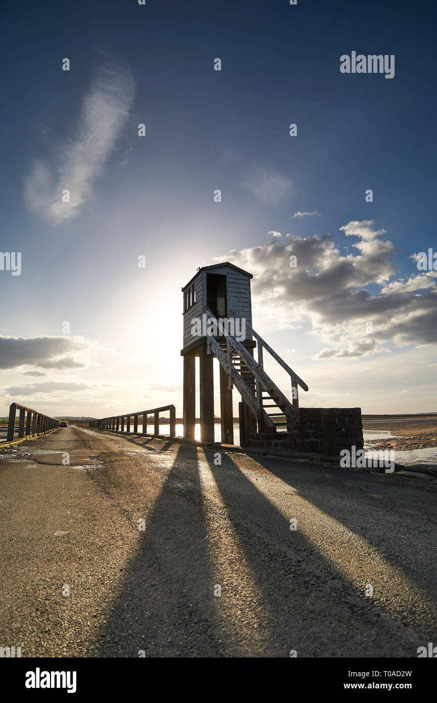 The Tidal causeway crossing to the Island of LIndisfarne (Holy Island) on the Northumbrian coast of England, UK, GB. Stock Photo