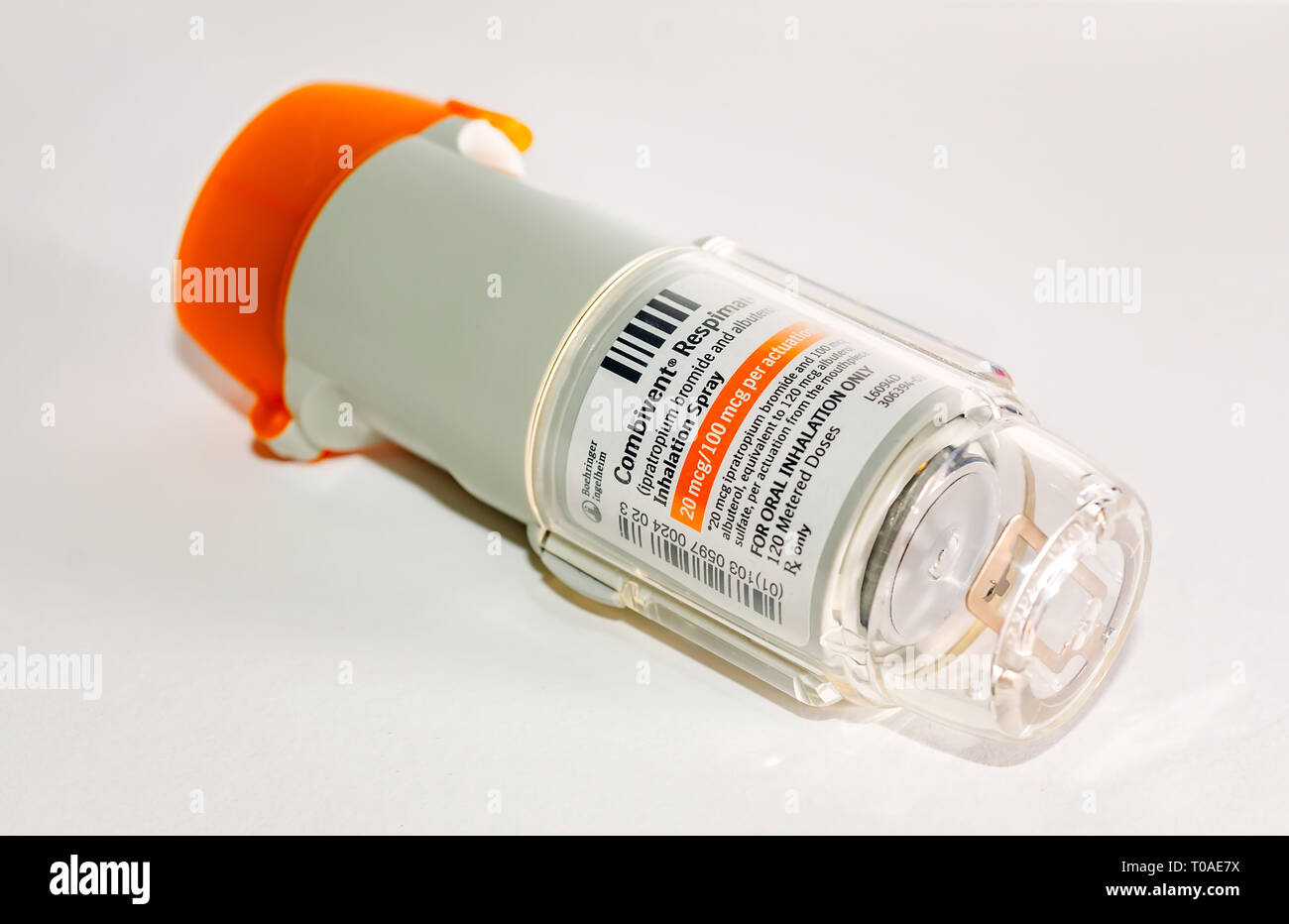 A Combivent Respimat asthma inhaler is pictured on white. Combivent Respimat, made by Boehringer Ingelheim, contains ipratropium bromide and albuterol. Stock Photo