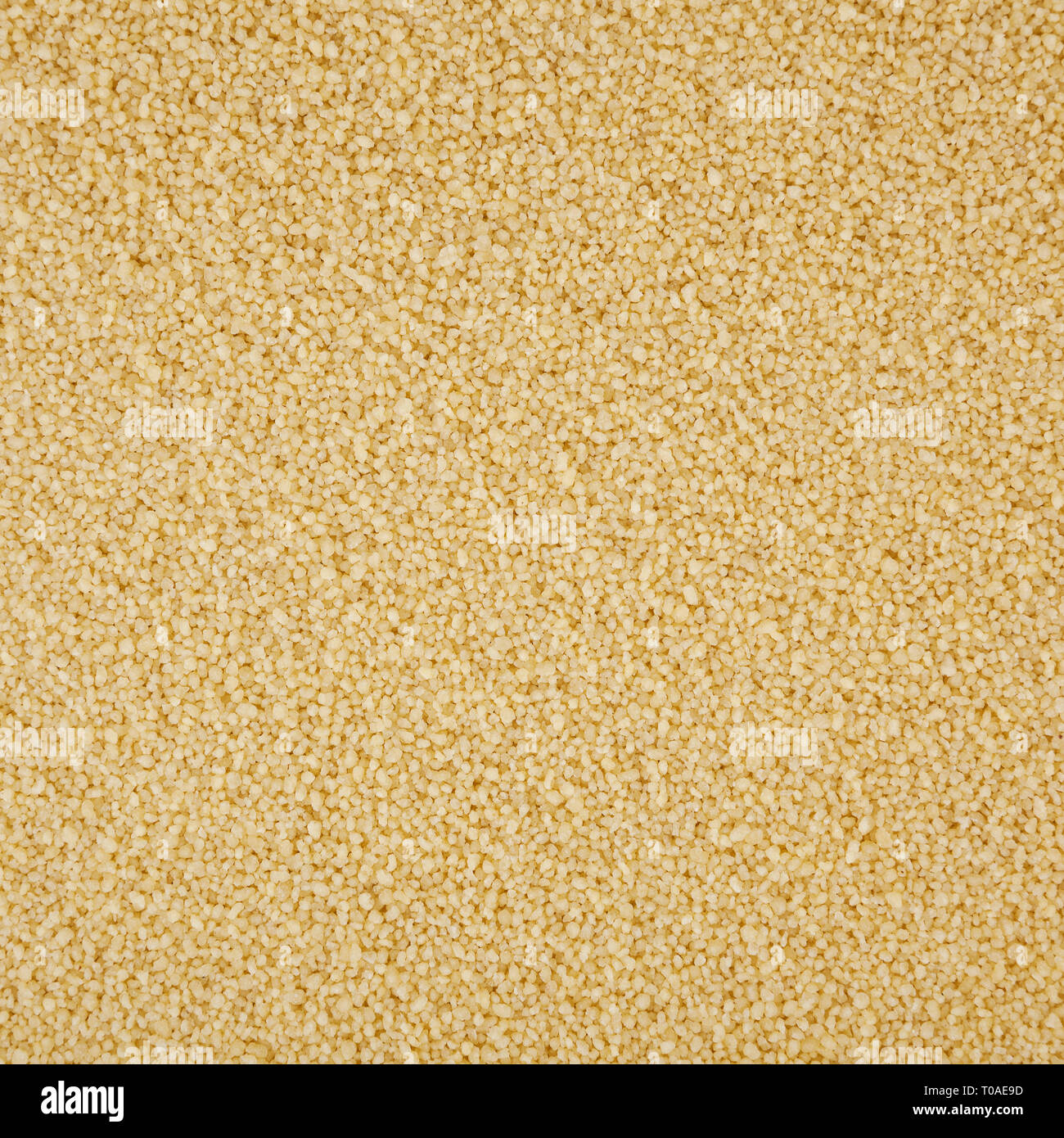 Uncooked couscous background Stock Photo