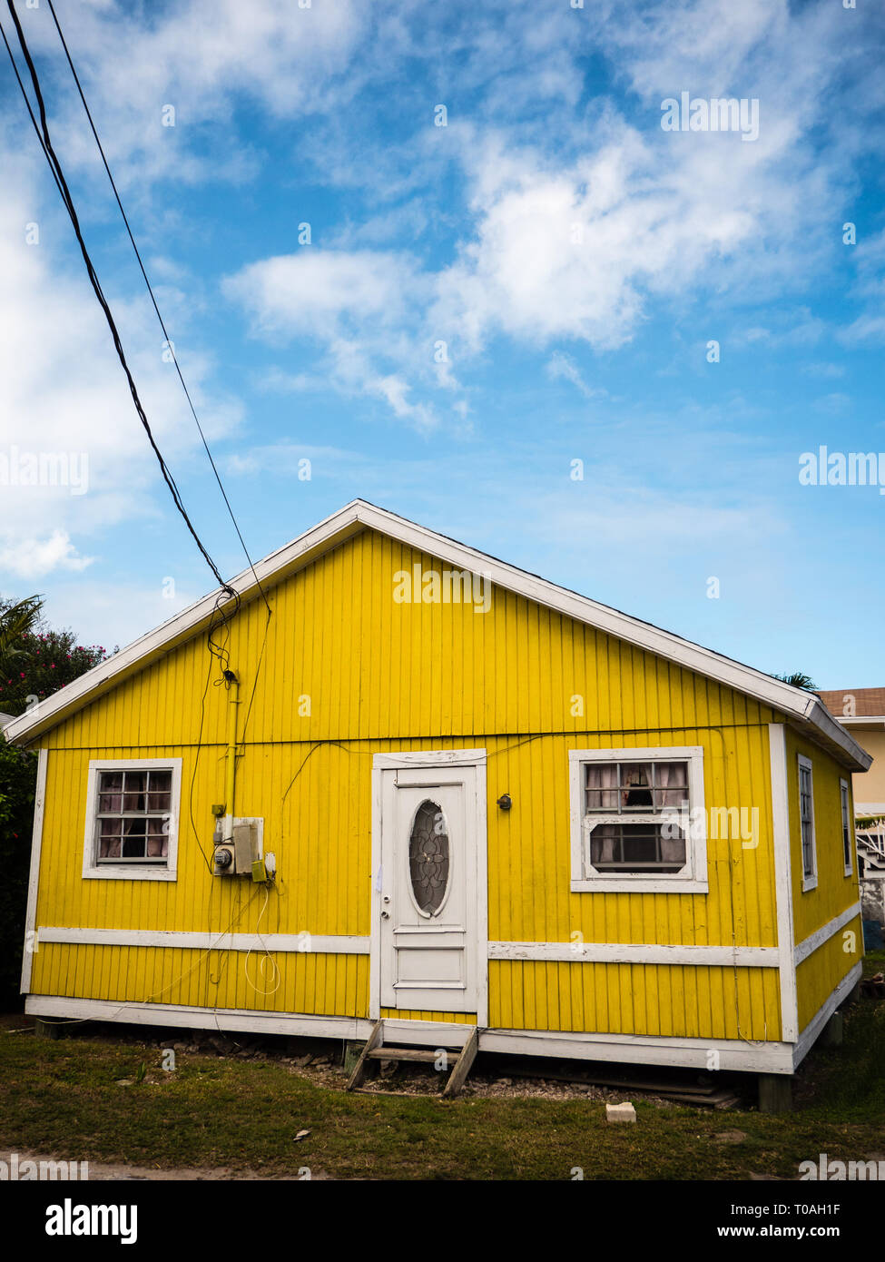 Yellow Typical Bahamas House, Dunmore Town, Harbour Island, Bahamas, Eleuthera, The Bahamas. Stock Photo