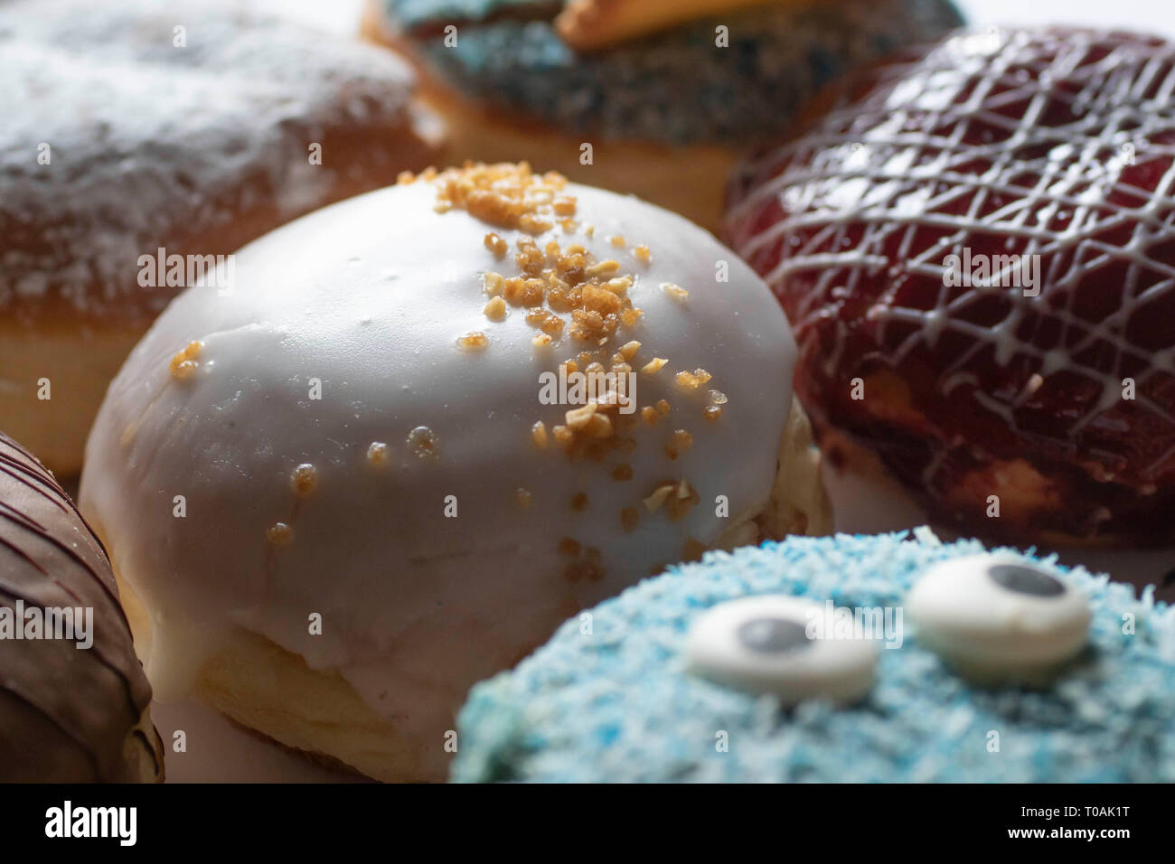 Delicious freshly baked Berliner with various toppings Stock Photo - Alamy