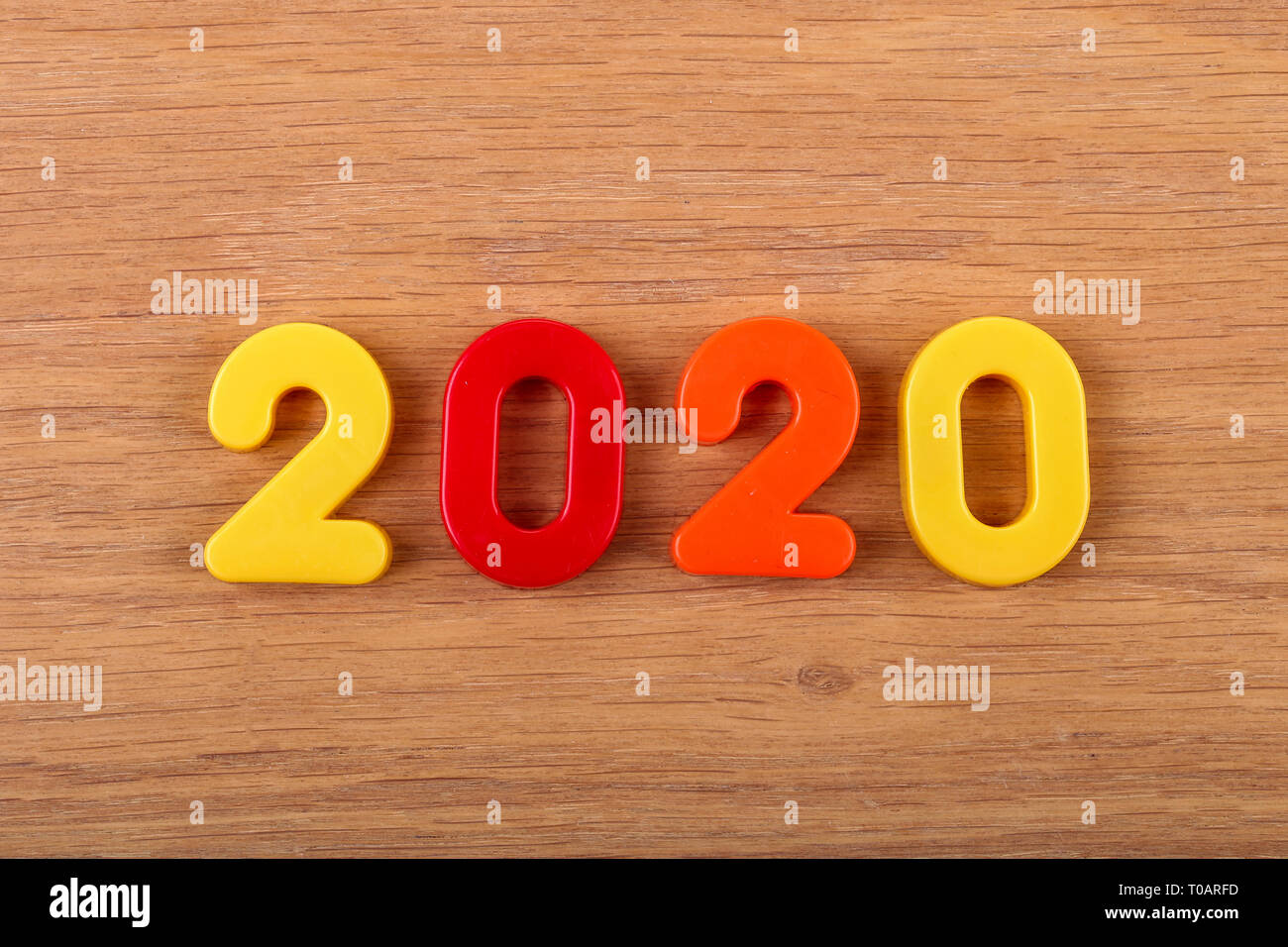 Year 2020 celebrated with multi colored numbers Stock Photo