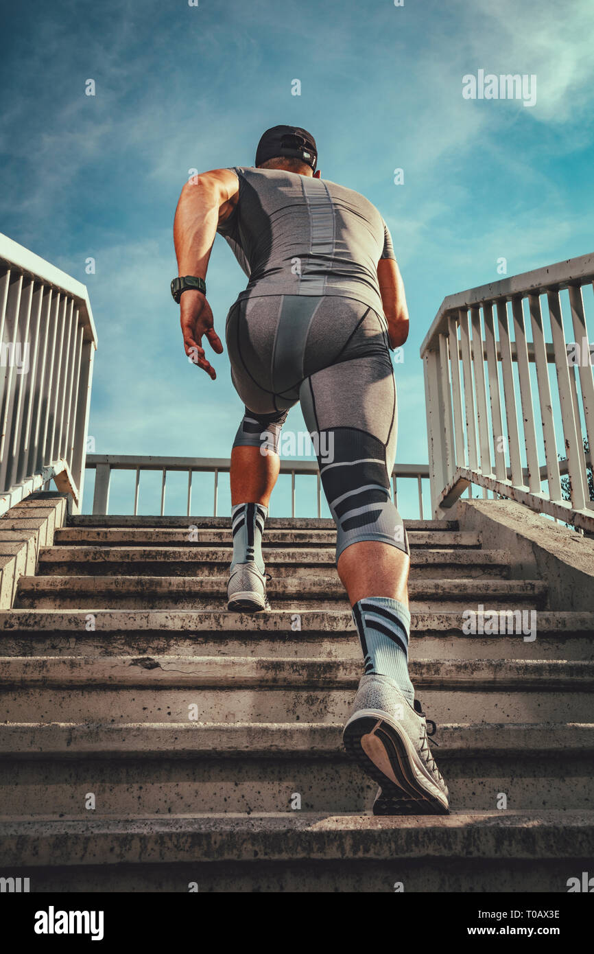 Man running up bridge stairs hi-res stock photography and images - Alamy