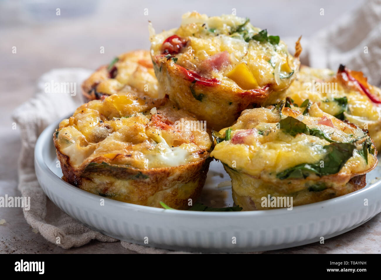 Egg muffins with ham, cheese and vegetables Stock Photo Alamy