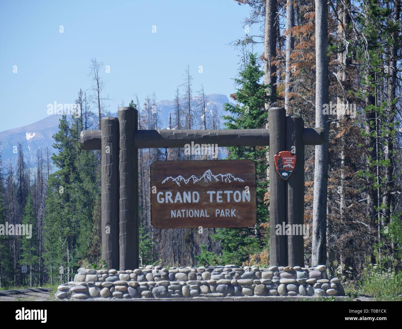 Grand Teton National Park sign on the boundary of Yellowstone National Park. Stock Photo