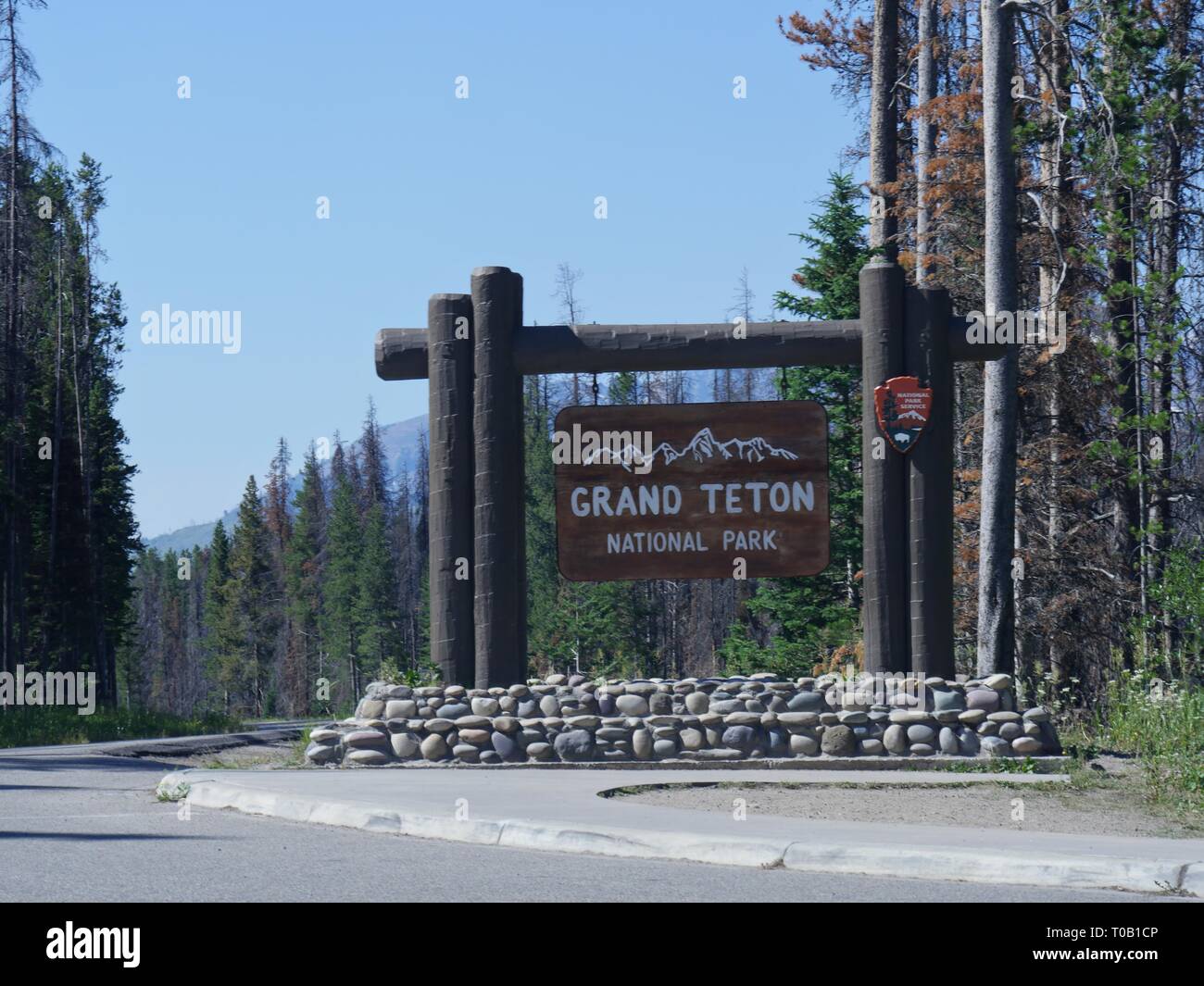 View of Grand Teton National Park sign on the boundary of Yellowstone National Park. Stock Photo