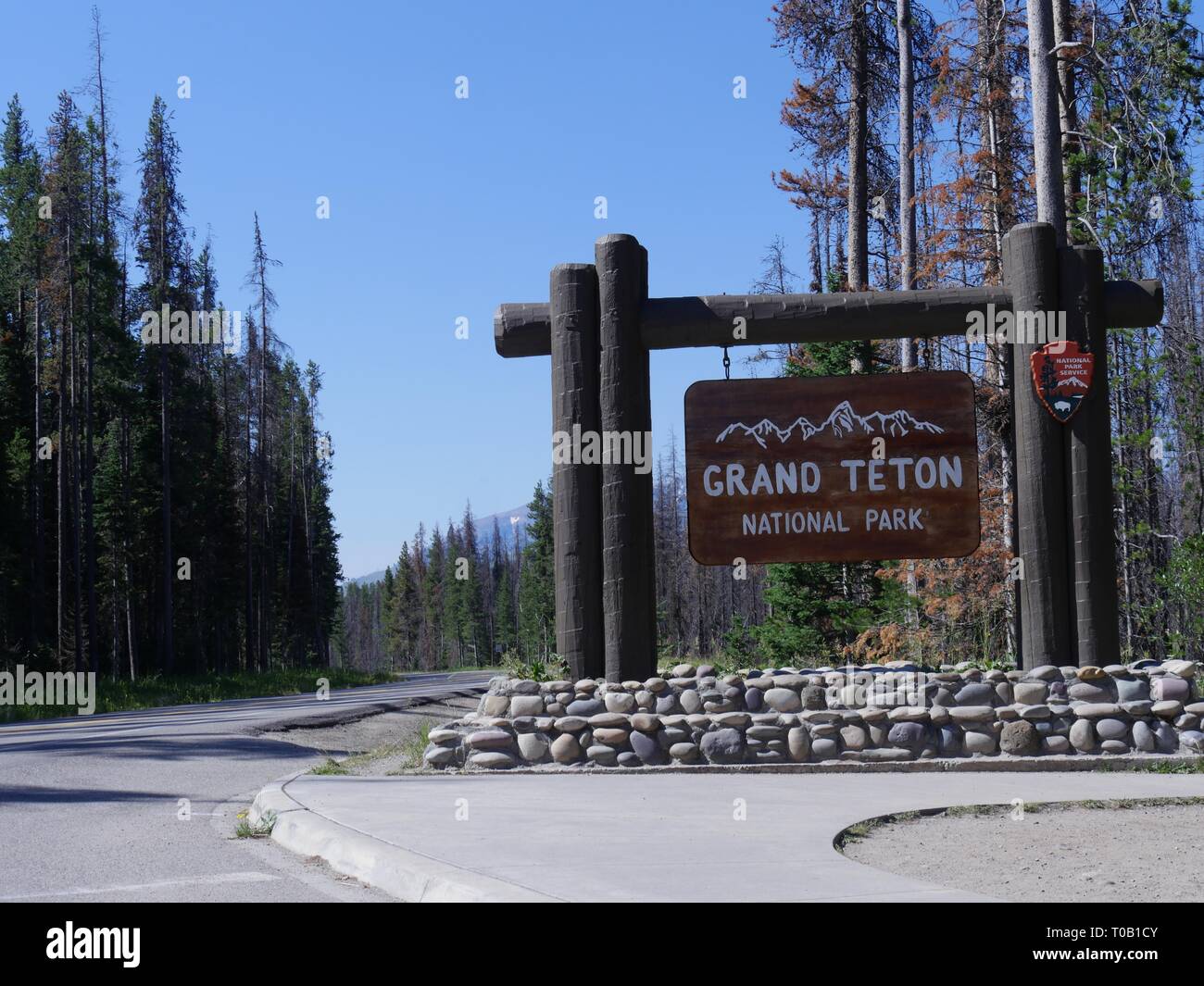 Scenic view of the Grand Teton National Park sign on the boundary of Yellowstone National Park. Stock Photo