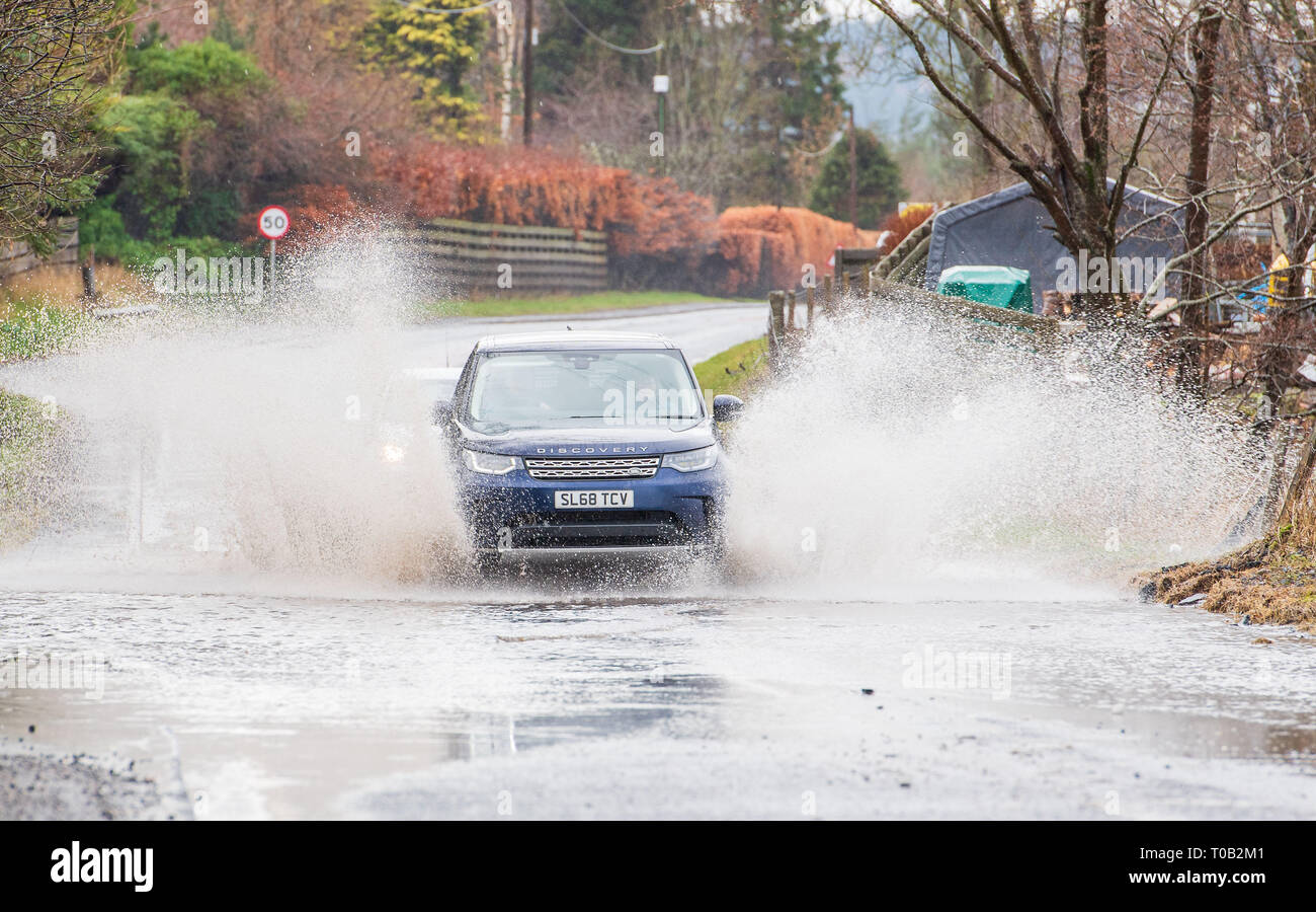 Motorists negotiate the flooded A72 near Peebles, Scottish Borders Stock Photo