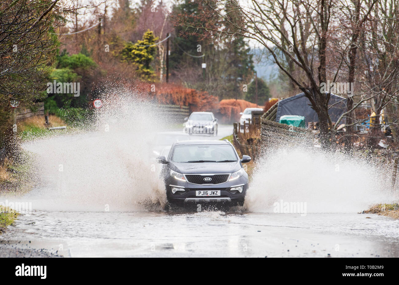 Motorists negotiate the flooded A72 near Peebles, Scottish Borders Stock Photo