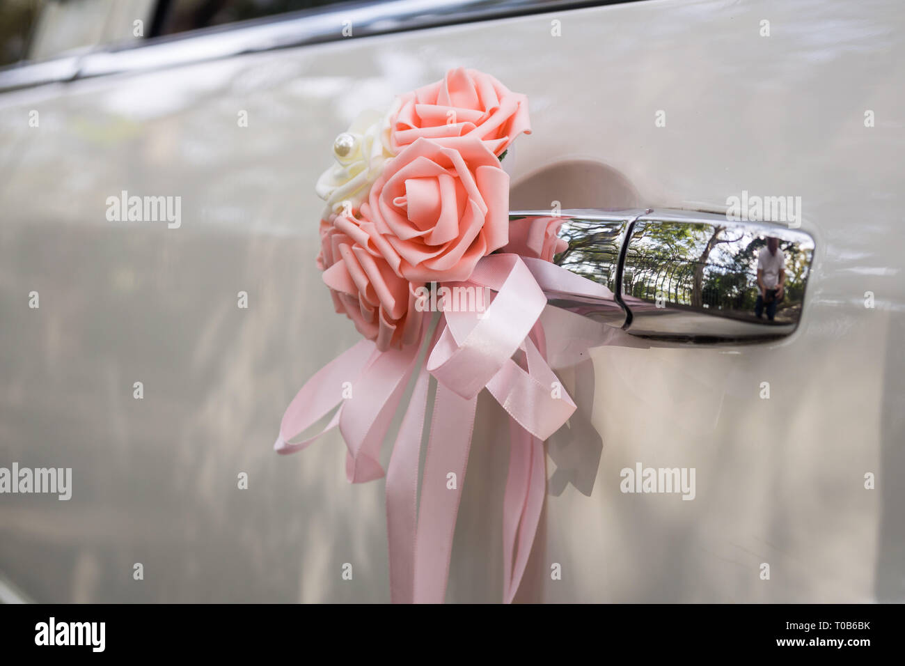 Floral detail on a wedding car Stock Photo