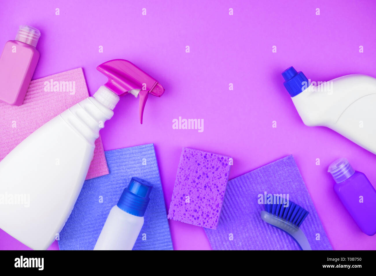 House cleaning products are on purple background Stock Photo - Alamy