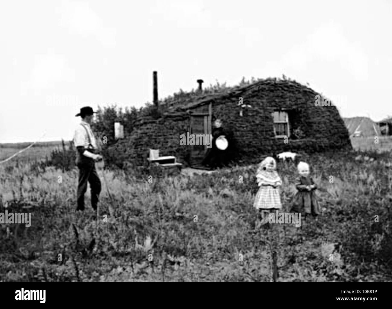 Norwegian settlers in front of their sod house in North Dakota in 1898