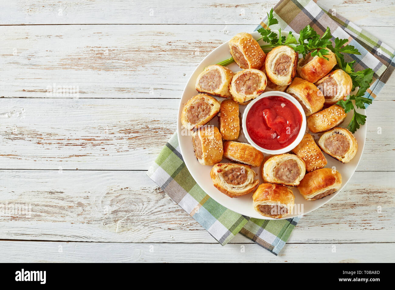 Overhead View Of Freshly Baked Puff Pastry Sausage Rolls With Ketchup 