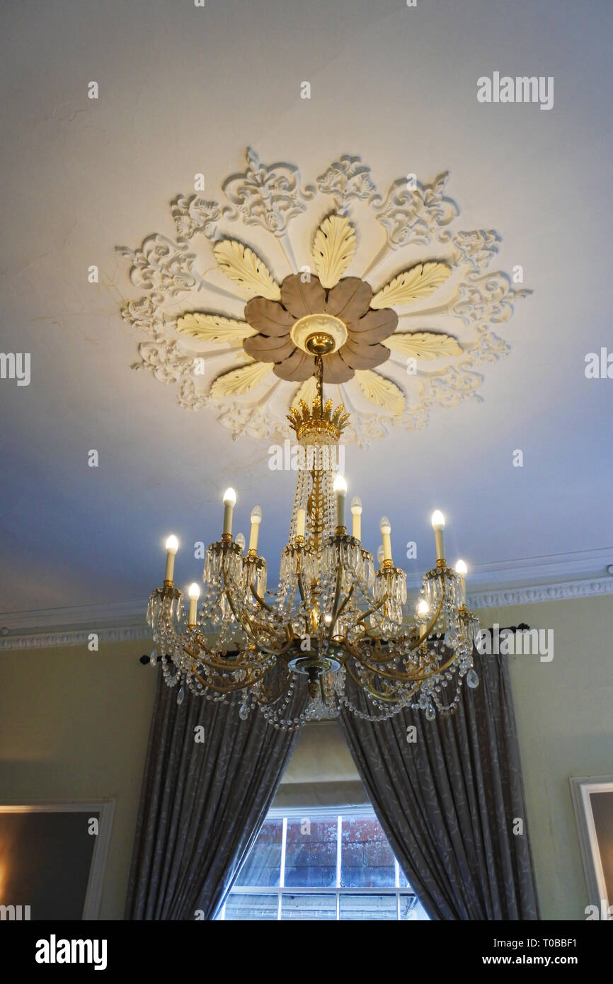 Classic crystal chandelier handing in a luxurious mansion - John Gollop Stock Photo