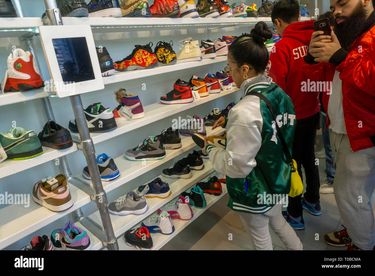 Wearing their finest street fashion, sneaker aficionados crowd the American  Eagle store's Urban Necessities pop-up in the Soho neighborhood of New York  on its grand opening day, Saturday, March 9, 2019. The