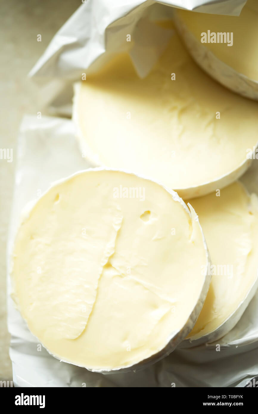 Cut brie cheese Stock Photo Alamy
