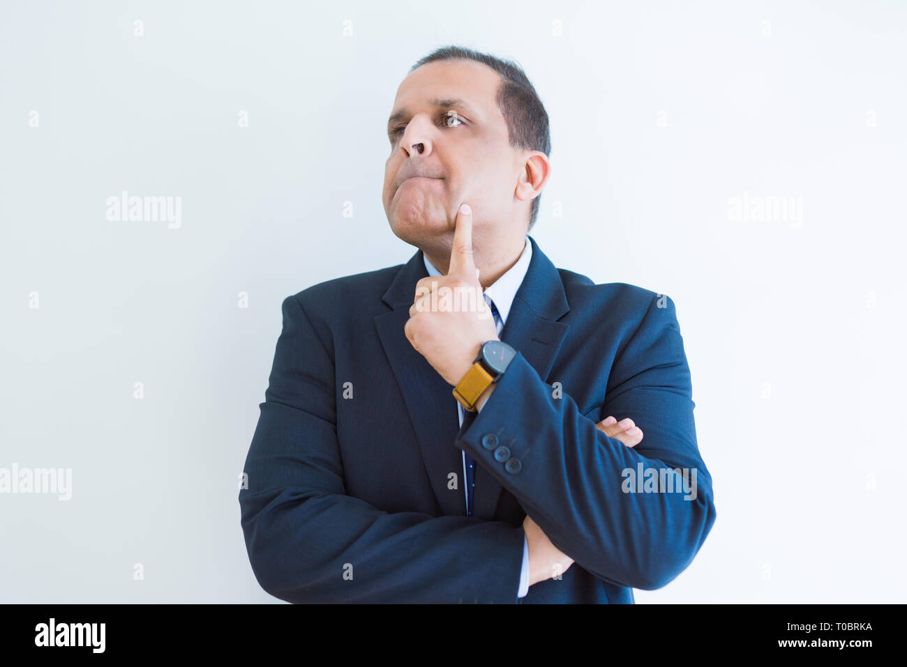 Middle age man thinking clueless about a question Stock Photo