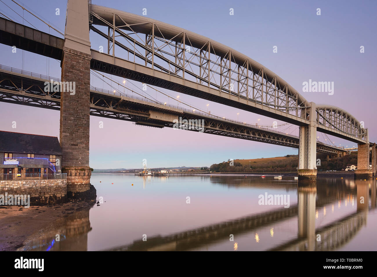 A dusk view of the Tamar Bridges, across the Hamoaze, estuary of the River Tamar, linking Plymouth in Devon and Saltash in Cornwall, Great Britain. Stock Photo