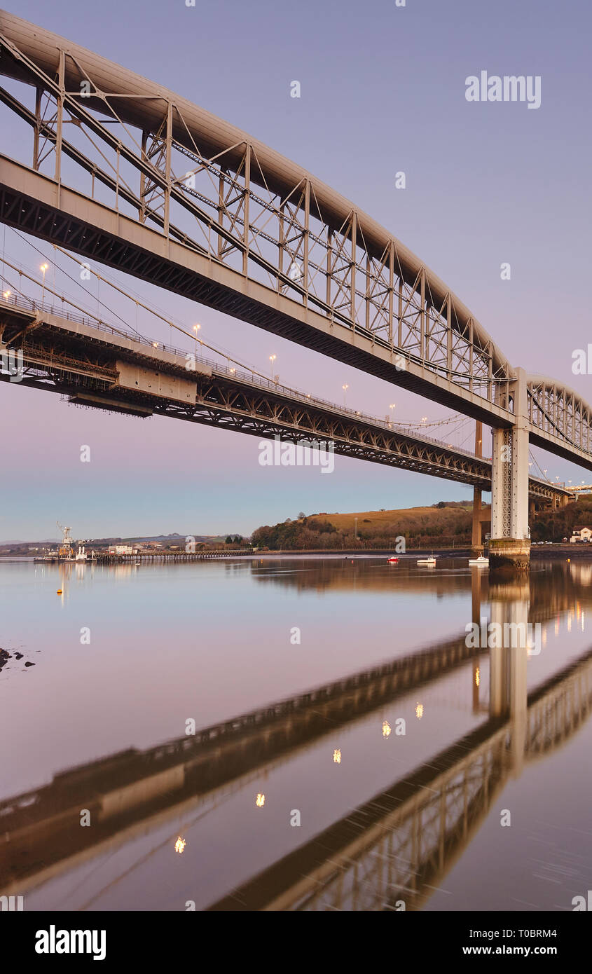 A dusk view of the Tamar Bridges, across the Hamoaze, estuary of the River Tamar, linking Plymouth in Devon and Saltash in Cornwall, Great Britain. Stock Photo